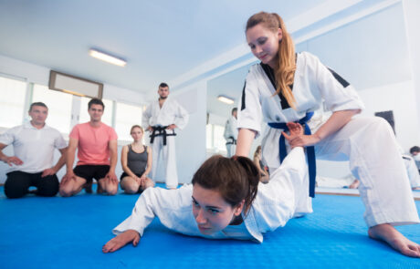 Female coach showing painful hold